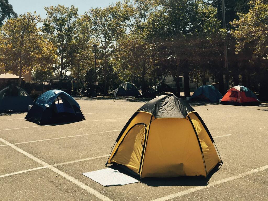 Homeless encampment in the vacant parking lot of the former Sonoma County Water Agency maintenance facility in Santa Rosa, Friday, Sept. 11, 2015. (ANGELA HART / PRESS DEMOCRAT)