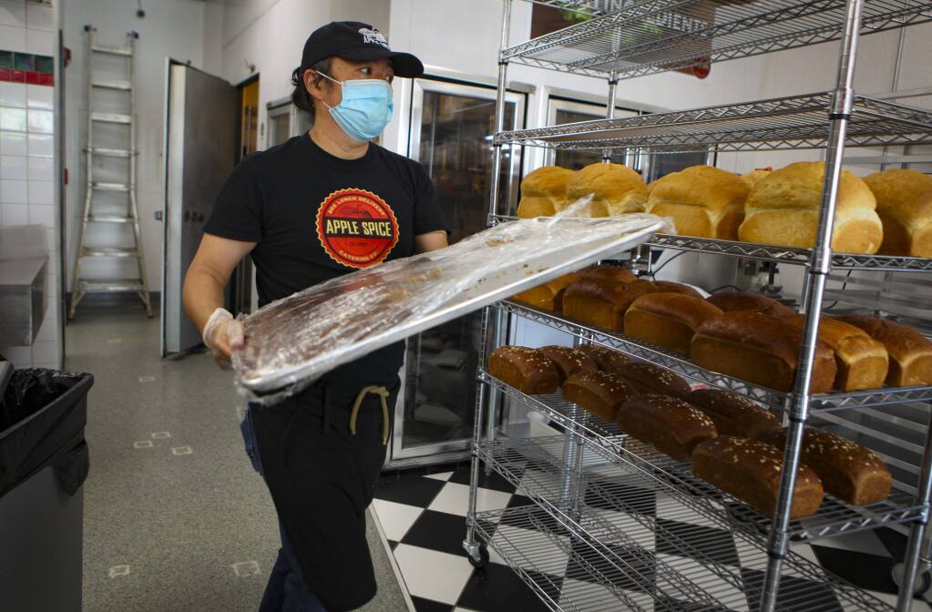 Petaluma, CA, USA. Tuesday, May 19, 2020._Derrick Ng, catering manager at newly opened Apple Spice on Lakeville in Petaluma prepares deserts and sides. The box-lunch facility opened in the midst of the pandemic but its takeout and delivery model works perfectly for this time.(CRISSY PASCUAL/ARGUS-COURIER STAFF)