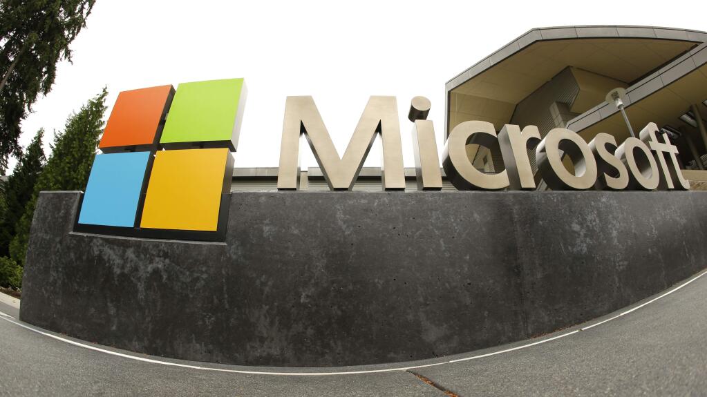 FILE - This July 3, 2014, file photo, shows the Microsoft Corp. logo outside the Microsoft Visitor Center in Redmond, Wash. (AP Photo Ted S. Warren, File)