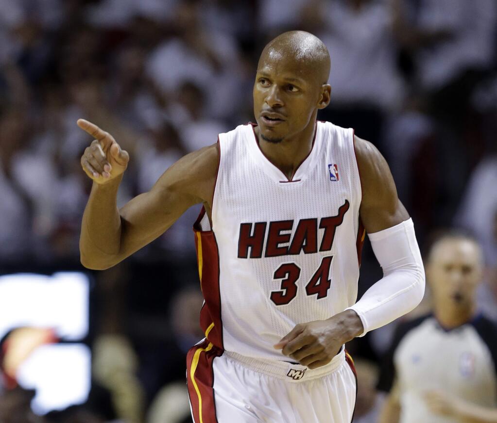 FILE - In a Friday, May 30, 2014 file photo, Miami Heat guard Ray Allen gestures after scoring a three-point basket during the first half Game 6 in the NBA basketball playoffs Eastern Conference finals against the Indiana Pacers, in Miami. Allen announced his retirement from the NBA on Tuesday, Nov. 1, 2016, ending a career that saw him make more 3-pointers than any player in league history and win championships with Boston and Miami. (AP Photo/Lynne Sladky, File)