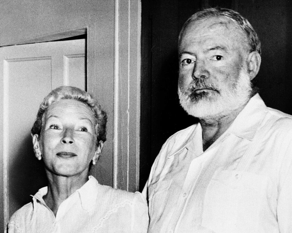 Novelist Ernest Hemingway and his wife Mary Welsh pose at their home in San Francisco de Paula, outside Havana, Cuba, Oct. 28, 1954, at a press conference after he heard he won the 1954 Nobel prize for his work 'The Old Man and the Sea'. (AP Photo)