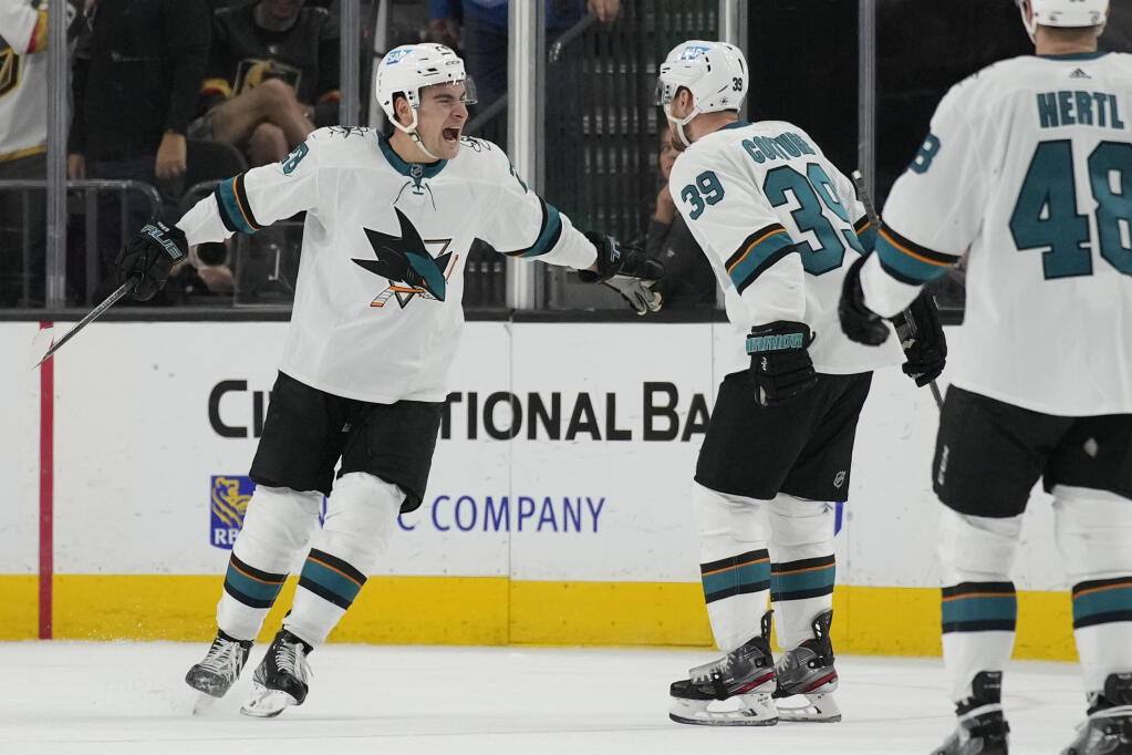 San Jose Sharks right wing Timo Meier, left, celebrates after scoring against the Vegas Golden Knights during the third period of an NHL hockey game Sunday, April 24, 2022, in Las Vegas. (AP Photo/John Locher)
