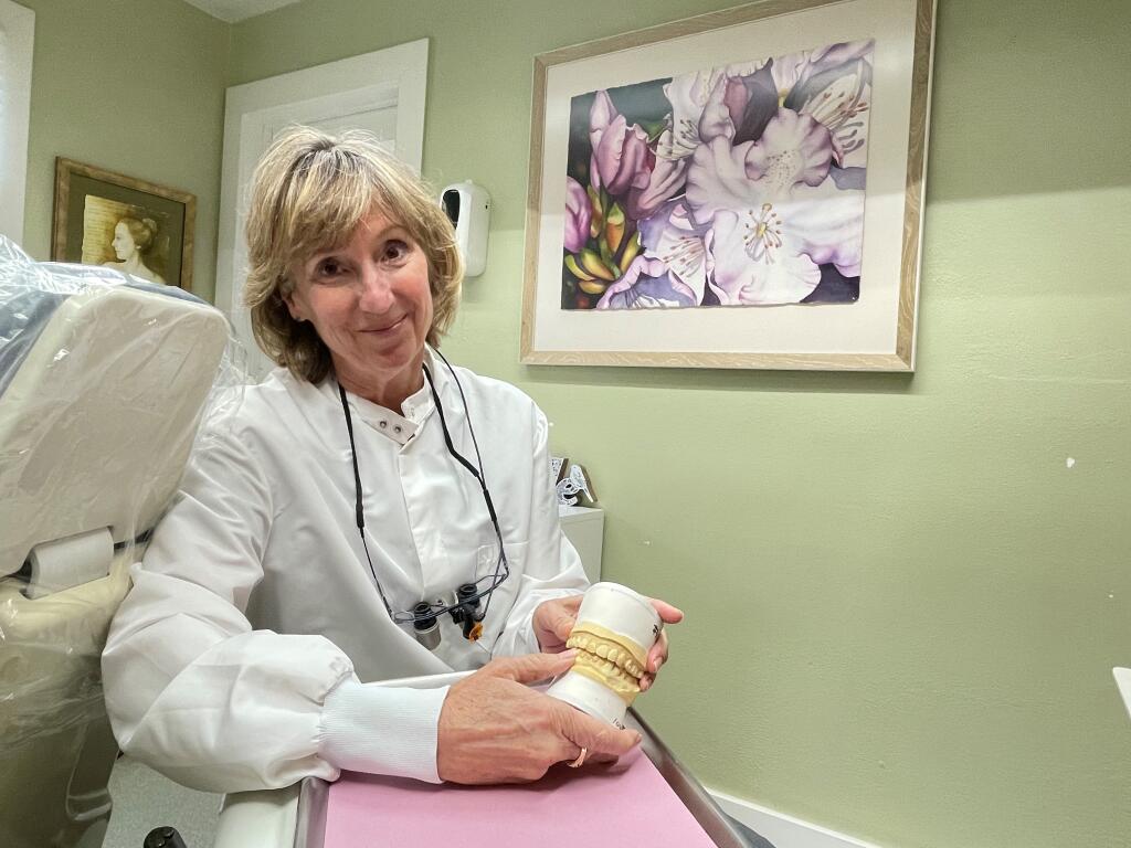 Dentist Dr. Julie Forstadt shows off a model of a mouth at her dentistry on Broadway in the City of Sonoma on Tuesday, July 12. Forstadt has provided free dental care to unhoused residents of Sonoma Valley. (Chase Hunter/Index-Tribune)