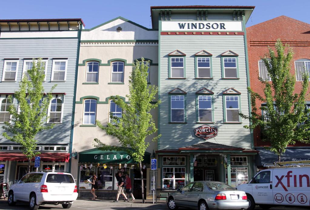 6/5/2005: O20: WINDSOR: $160 million Town Green Village is only half finished, but it's already considered a success.3/28/2004: A1: Windsor's Town Green Village, once the site of empty fields and rundown houses, when complete will consist of 27 buildings housing 80 to 100 businesses with 250 two-story townhouses above. The vintage-look buildings are adjacent to the 4-acre town green, site of a farmers market and concerts.PC: Windsor's Town Green Village once was a field and run down houses, but will soon become 200 residential condos above about 100 businesses in 27 total buildings when all phases of the development are completed.