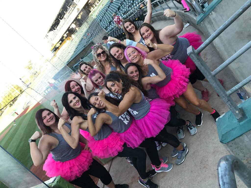 TUTU MUCH FUN: Petaluma's Shelley Klaner (in front, with tutu AND pink hair, danced at a River Cats game in August (then did ' burpees' on the field). All for a good cause.