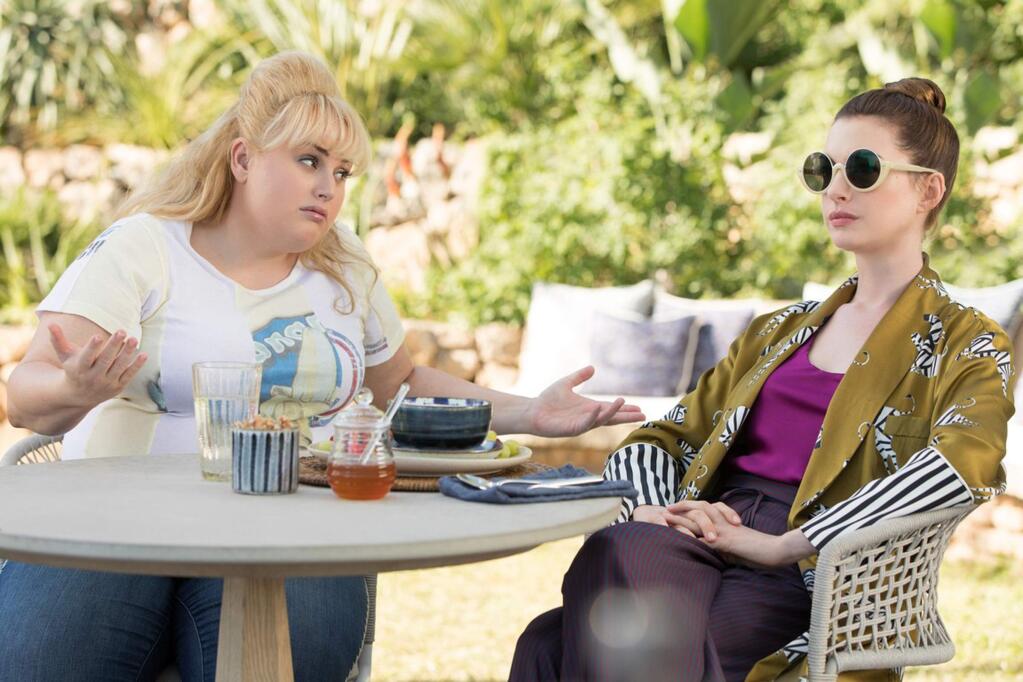 Rebel Wilson, left, and Anne Hathaway haplay a pair of con artists plying their trade in a stunning seaside town in the south of France in 'The Hustle.' (MGM)