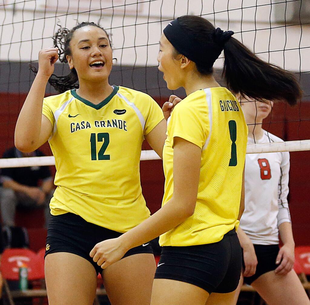 Casa Grande's Lina Fakalata (12) and Kaitlyn Wong (8) celebrate a good play during the NCS Division 2 varsity volleyball playoff game between Casa Grande and Montgomery high schools in Santa Rosa on Wednesday, Oct. 24, 2018. (Alvin Jornada / The Press Democrat)