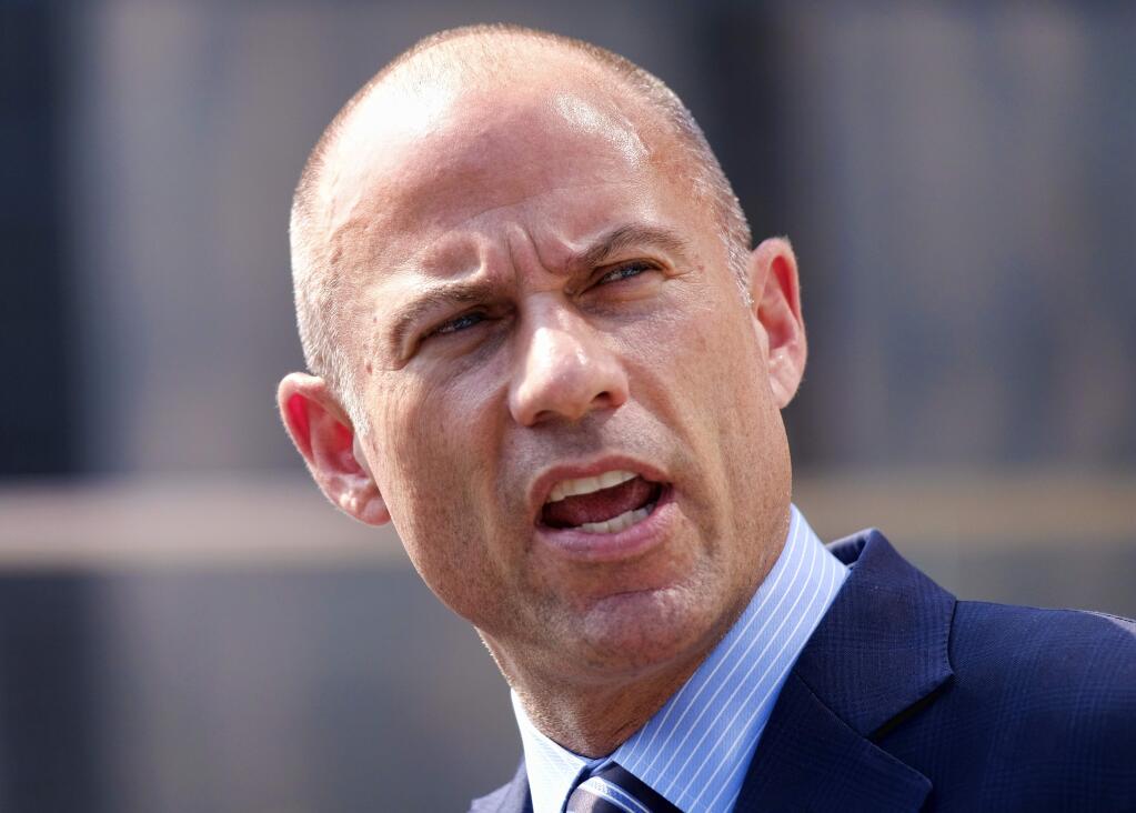 FILE - In this July 27, 2018, file photo Michael Avenatti, talks to the media during a news conference in front of the U.S. Federal Courthouse in Los Angeles. Avenatti is in police custody in Los Angeles following domestic violence allegation. (AP Photo/Richard Vogel, File)