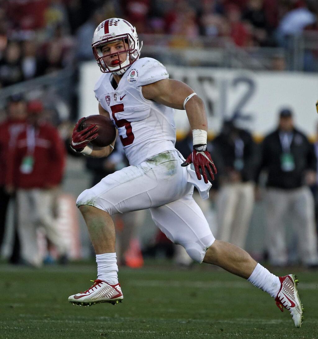 Stanford running back Christian McCaffrey runs against Iowa during the second half of the Rose Bowl NCAA college football game, Friday, Jan. 1, 2016, in Pasadena, Calif. (AP Photo/Lenny Ignelzi)