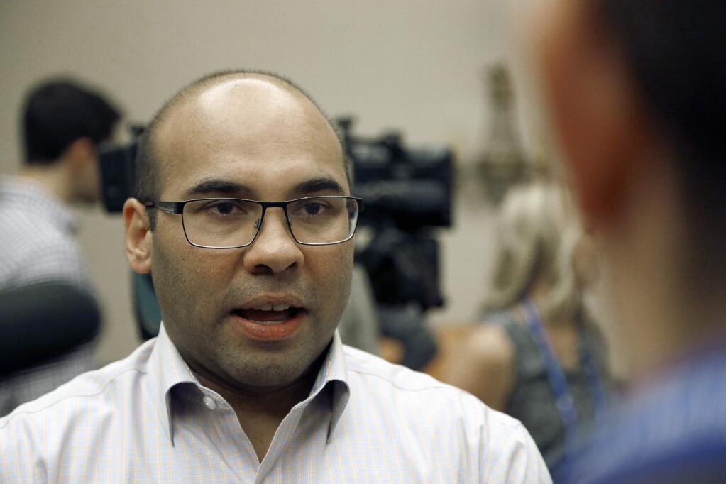 In this Wednesday, Nov. 9, 2016 file photo, then-Dodgers general manager Farhan Zaidi talks with the media during the annual GM meetings in Scottsdale, Ariz. (AP Photo/Ross D. Franklin, File)