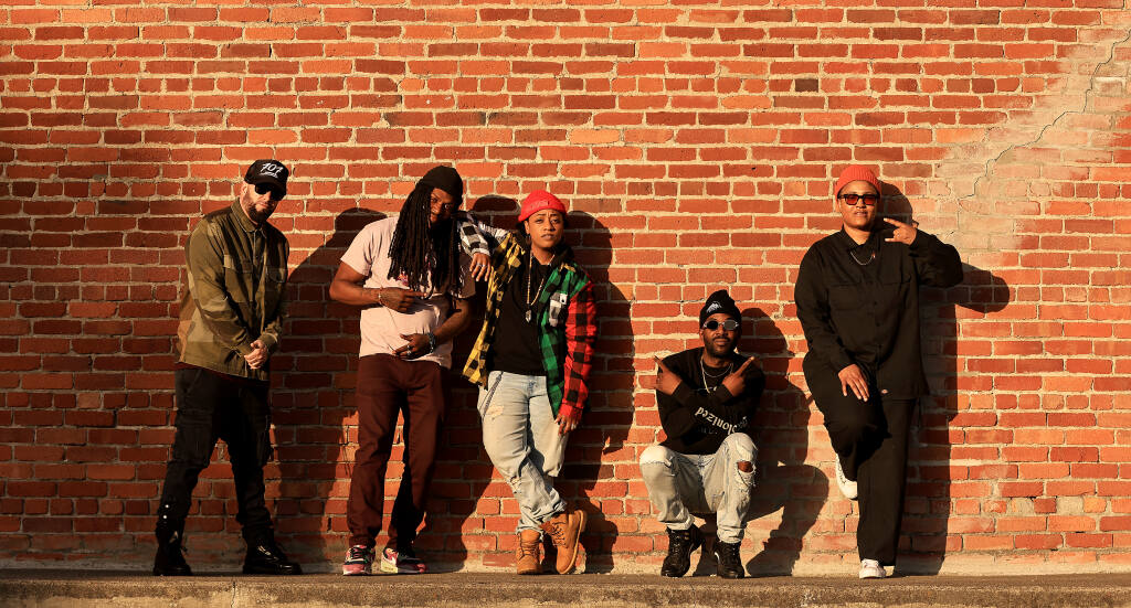 Local hip-hop musicians, from left, Vocab Slick, KingLung, Erica Ambrin, Damion Square and Kayatta, on Friday, April 14, 2023, in Santa Rosa. As the genre marks 50 years since its beginnings in the Bronx, hip-hop’s presence is growing in Sonoma County. (Kent Porter / The Press Democrat)