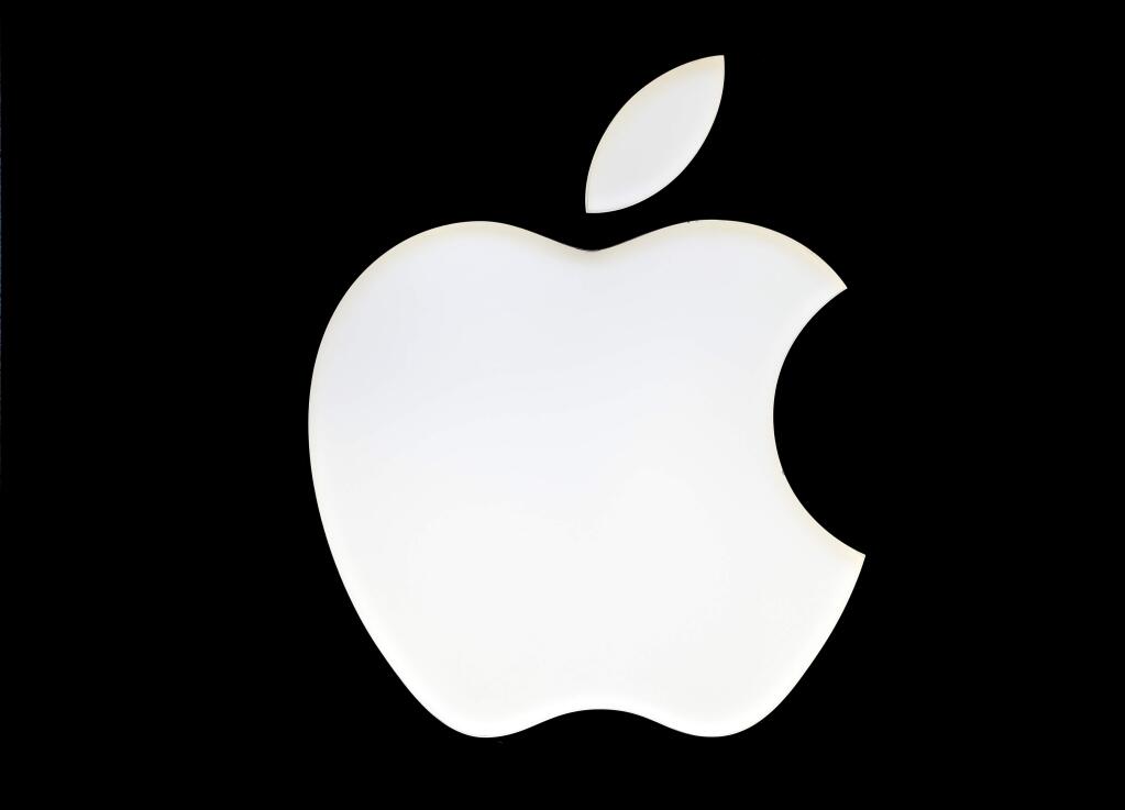 FILE - In this Wednesday, Jan. 4, 2017 file photo, a logo of the Apple company is pictured in Berlin, Germany. (AP Photo/Michael Sohn, File)