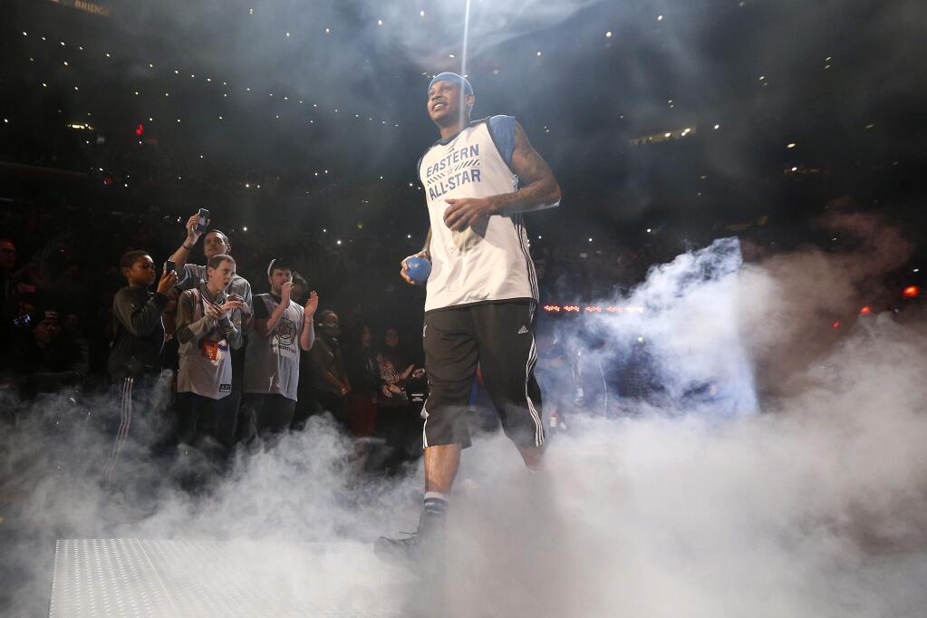 East Team's Carmelo Anthony, of the New York Knicks, is introduced before a practice session ahead of the NBA All-Star basketball game, Saturday, Feb. 14, 2015, in New York. (AP Photo/Julio Cortez)