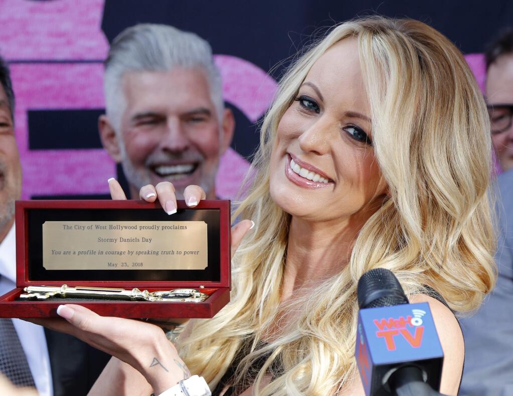 Stormy Daniels shows the Key during a ceremony for her receiving a City Proclamation and Key to the City on Wednesday, May 23, 2018 in West Hollywood, Calif. (AP Photo/Ringo H.W. Chiu)