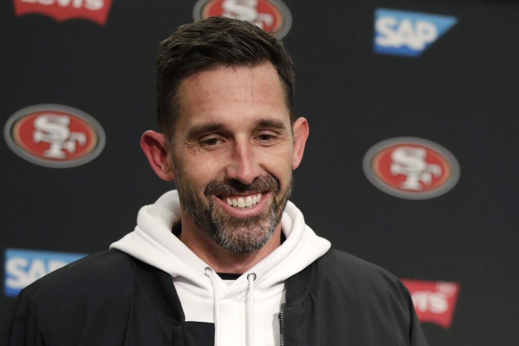 FILE - In this Dec. 29, 2019, file photo, San Francisco 49ers head coach Kyle Shanahan smiles during a news conference after an NFL football game against the Seattle Seahawks in Seattle. The 49ers rewarded Shanahan with a new six-year contract Monday, June 15, 2020, after he took the team to the Super Bowl in his third season at the helm. A person familiar with the deal said the Niners are replacing the three years remaining on Shanahan's original six-year contract signed in 2017 to keep him under contract through 2025. The person spoke on condition of anonymity because the deal hasn't been announced. (AP Photo/Stephen Brashear, File)