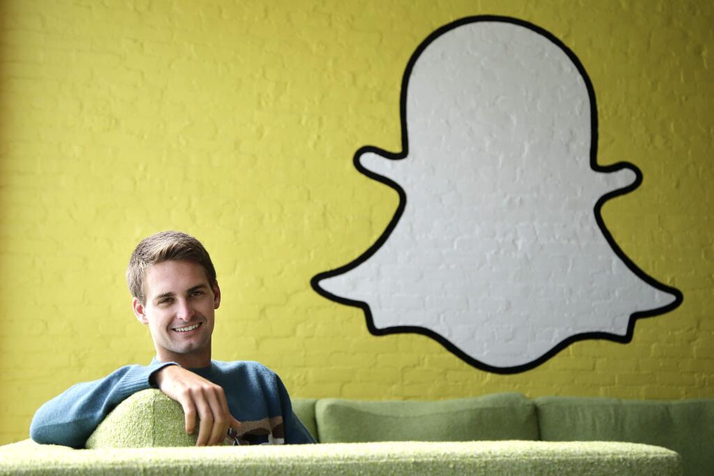 FILE - In this Thursday, Oct. 24, 2013, file photo, Snapchat CEO Evan Spiegel poses for a photo in Los Angeles. (AP Photo/Jae C. Hong, File)
