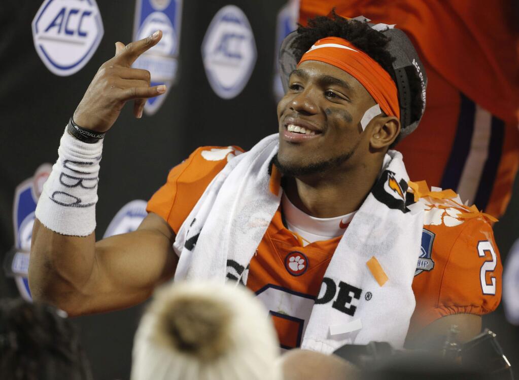 Clemson's Kelly Bryant (2) celebrates after winning the Atlantic Coast Conference championship NCAA college football game over Miami in Charlotte, N.C., Sunday, Dec. 3, 2017. (AP Photo/Bob Leverone)