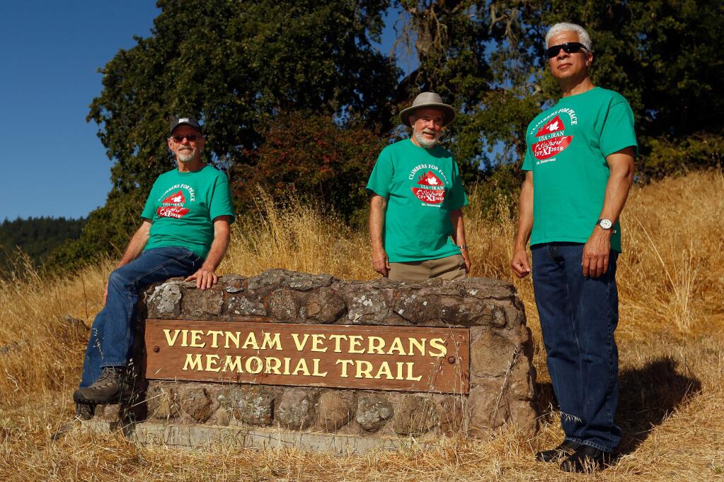 Dave Wahlstrom, left, Fred Ptucha, and Xavier Polk, all of Santa Rosa, pose for a portrait at the Vietnam Veterans Memorial Trailhead at Trione-Annadel State Park in Santa Rosa, California, on Thursday, June 28, 2018. The trio are departing Friday for a peace mission to climb Mount Daravand in Iran next week. (Alvin Jornada / The Press Democrat)
