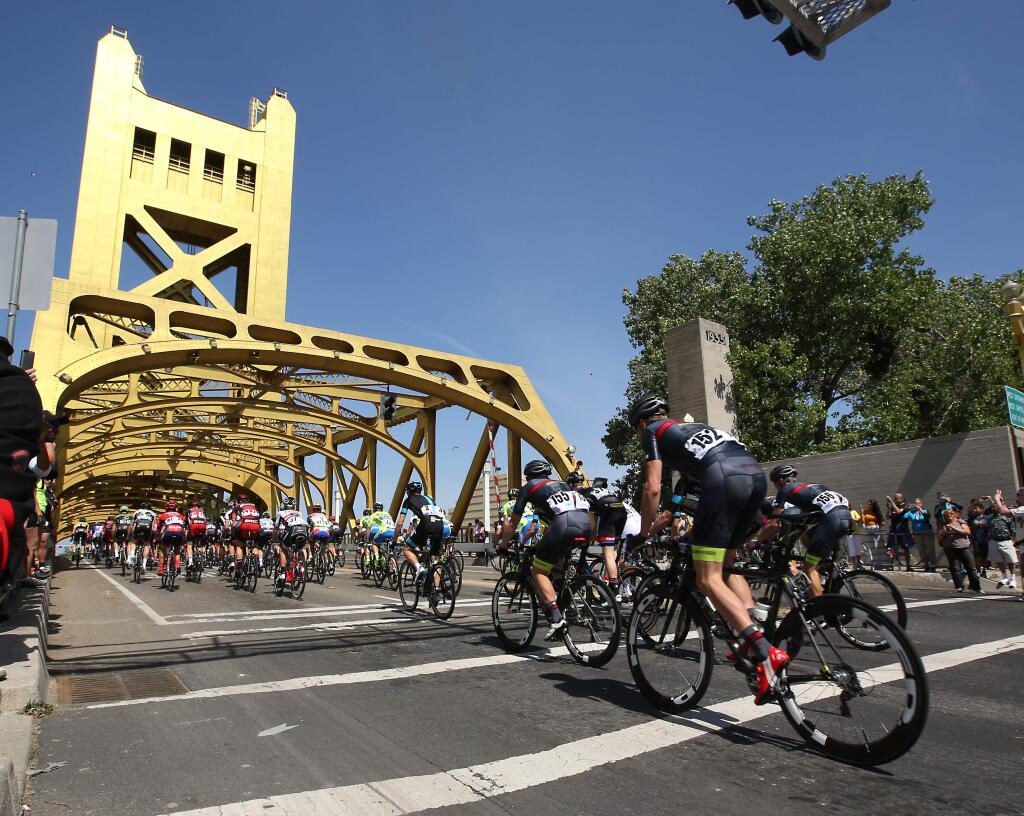 Riders cross the tower bridge during the first stage of the Amgen Tour of California cycling race in Sacramento, Calif., Sunday, May 10, 2015. (AP Photo/Rich Pedroncelli)