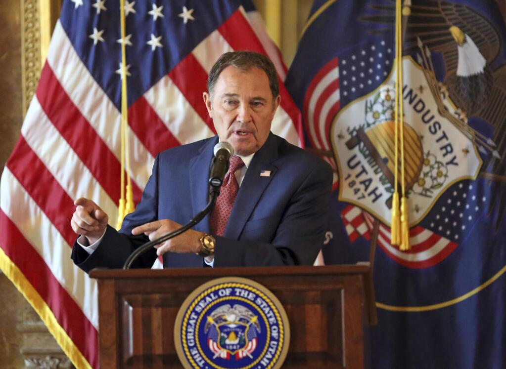 FILE - In this Sept. 12, 2018, file photo, Utah Gov. Gary Herbert speaks during a news conference at the Utah State Capitol, in Salt Lake City. The discredited practice of conversion therapy for LGBTQ children is now banned in Utah, making it the 19th state and one of the most conservative to prohibit it. Herbert took the unusual step of calling on regulators after a proposed law was derailed by changes made by conservative lawmakers. (AP Photo/Rick Bowmer, File)