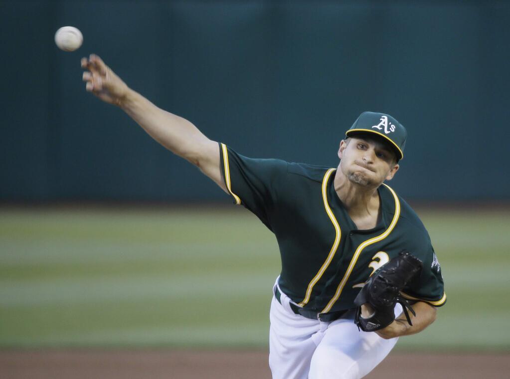 Oakland Athletics starting pitcher Kendall Graveman throws against the Colorado Rockies in the first inning of their baseball game Monday, June 29, 2015, in Oakland, Calif. (AP Photo/Eric Risberg)