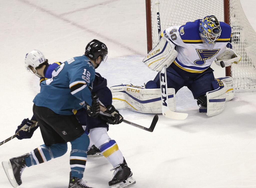 St. Louis Blues goalie Carter Hutton (40) defends a shot by San Jose Sharks center Patrick Marleau (12) during the first period of an NHL hockey game in San Jose, Calif., Saturday, Jan. 14, 2017. (AP Photo/Jeff Chiu)