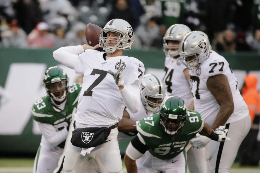 Oakland Raiders quarterback Mike Glennon (7) throws a pass during the second half of an NFL football game against the New York Jets Sunday, Nov. 24, 2019, in East Rutherford, N.J. (AP Photo/Seth Wenig)