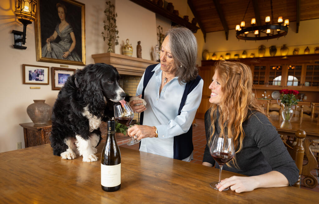 Cristina Torres, right, and her mother Marimar Torres with Chico, the Marimar Estate Vineyards and Winery dog, Friday, Feb. 3, 2023. (John Burgess/The Press Democrat)
