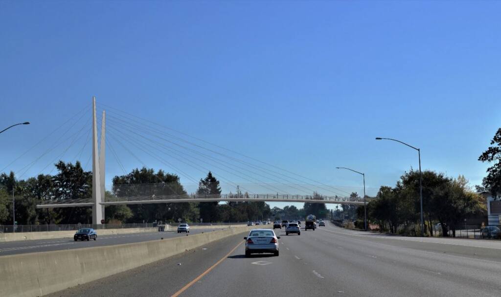 A digital rendering of the proposed Highway 101 bicycle and pedestrian crossing from Elliott Avenue to Edwards Avenue, as viewed from the perspective of a southbound highway driver. (City of Santa Rosa)