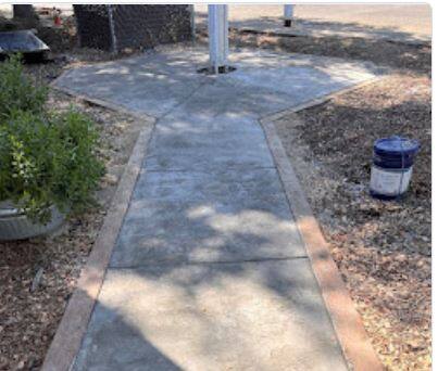 The completed improved concrete path to the flagpole at the Cloverdale Memorial Veterans Building. (Sonoma County)