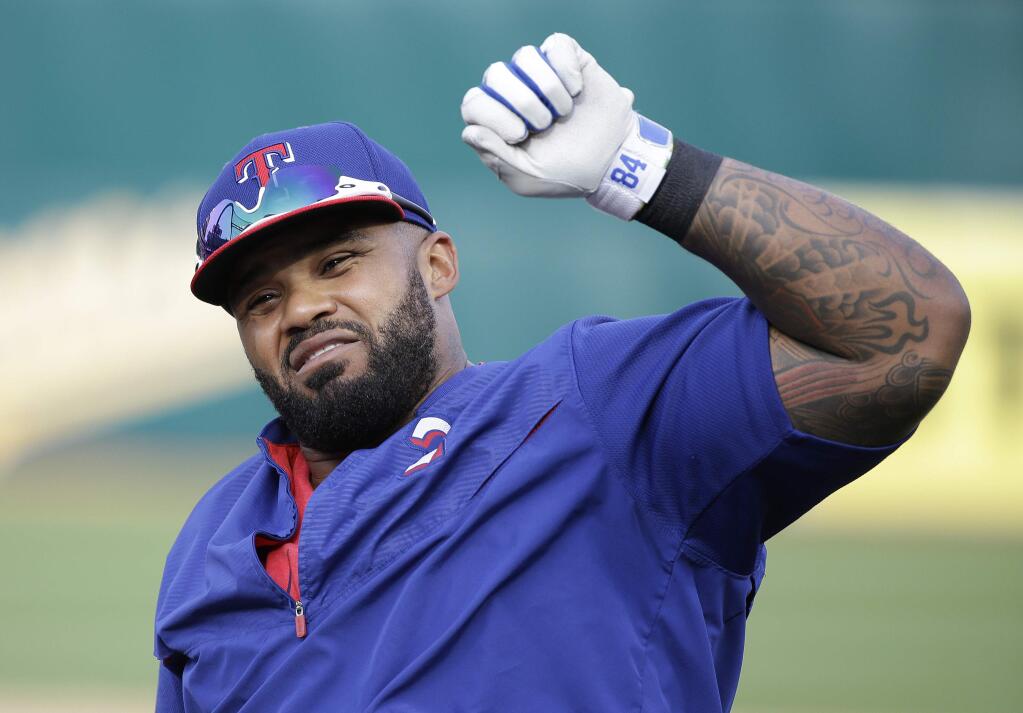 Texas Rangers first baseman Prince Fielder stretches during batting practice before the start of their opening day baseball game against the Oakland Athletics, Monday, April 6, 2015, in Oakland, Calif. (AP Photo/Eric Risberg)