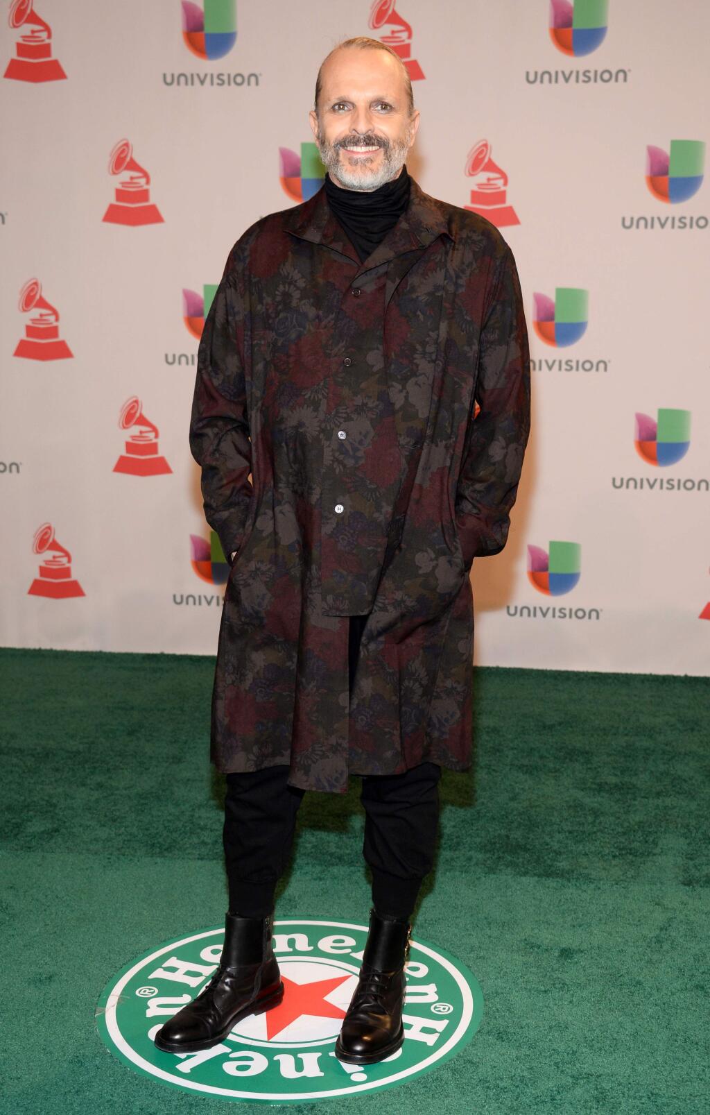Miguel Bose arrives at the 15th annual Latin Grammy Awards at the MGM Grand Garden Arena on Thursday, Nov. 20, 2014, in Las Vegas. (Photo by Al Powers/Invision/AP)