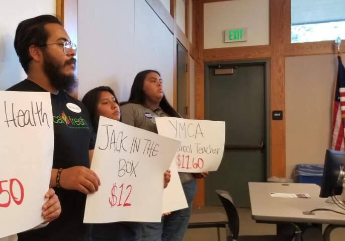 Labor advocates brandished wage signs during the June 3 meeting of the Sonoma City Council.