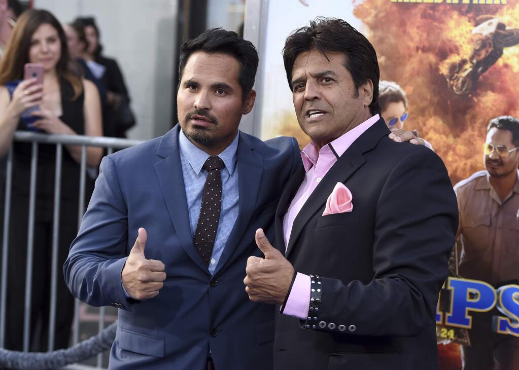 Michael Pena, left, and Erik Estrada pose at the Los Angeles premiere of 'CHIPS' at the TCL Chinese Theatre on Monday, March 20, 2017. (Photo by Jordan Strauss/Invision/AP)