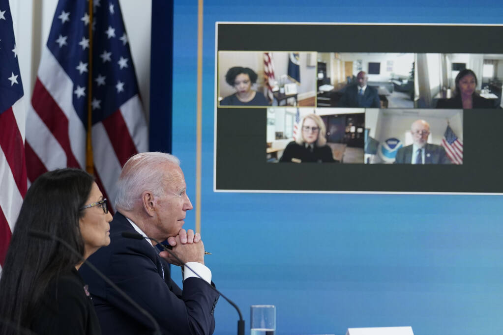 President Joe Biden, right, and Interior Secretary Deb Haaland, left, listen during an event in the South Court Auditorium on the White House complex in Washington, Wednesday, June 30, 2021, with cabinet officials and governors from Western states to discuss drought and wildfires. (AP Photo / Susan Walsh)