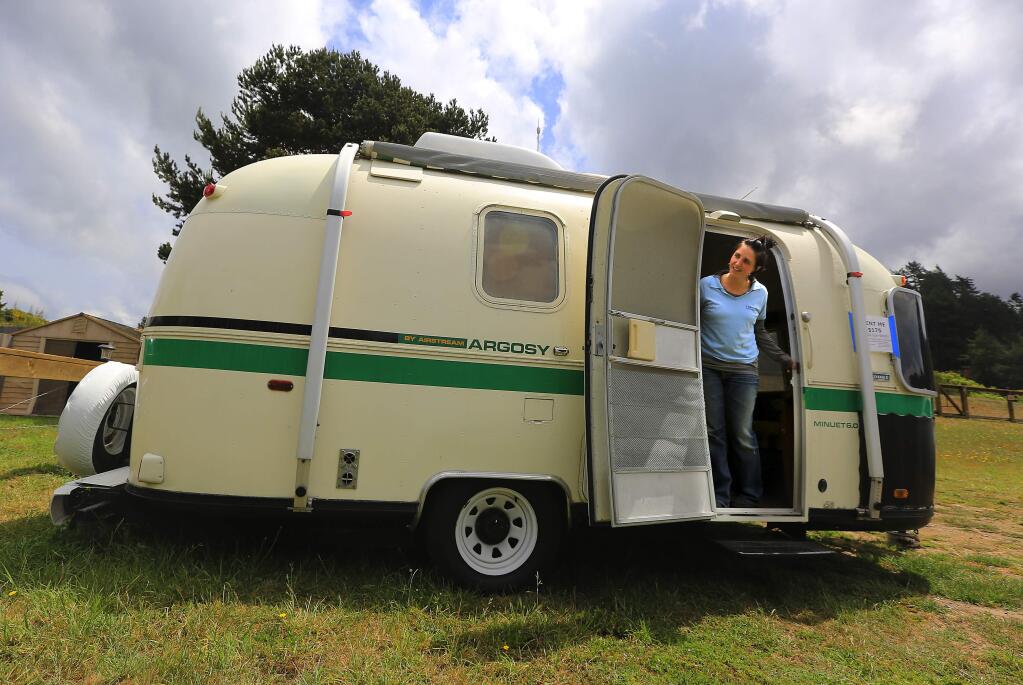 PHOTO: 1 by JOHN BURGESS / The Press Democrat-Sara Jane Callister shows off the honeymoon trailer at Casini Ranch Family Campground in Duncans Mills.