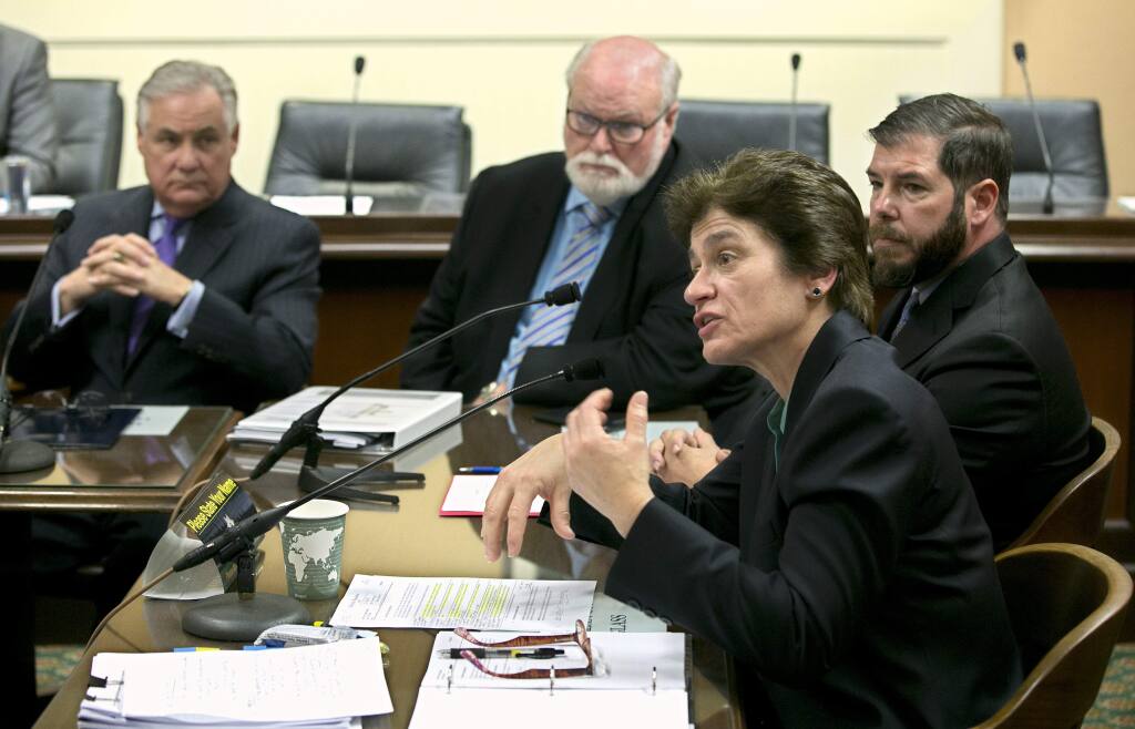State auditor Elaine Howle told lawmakers that it would take her office six to nine months to audit the state's high-speed rail project while appearing before the Joint Legislative Audit Committee, Tuesday, Jan. 30, 2018, in Sacramento, Calif. The audit was called for by Assemblyman Jim Patterson, R-Fresno, left, state Sen. Jim Beall, D-San Jose, second from left and backed by Assemblyman Joaquin Arambula, D-Fresno, right, The audit was approved by the committee. (AP Photo/Rich Pedroncelli)