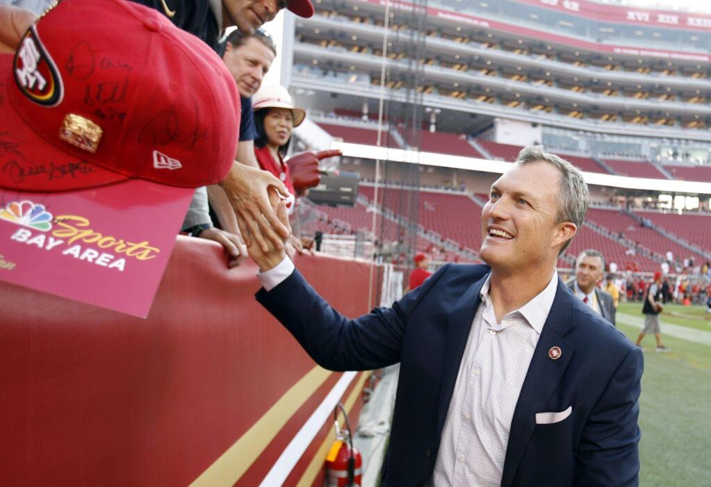 San Francisco 49ers general manager John Lynch signs autographs before a preseason game against the Los Angeles Chargers Thursday, Aug. 31, 2017, in Santa Clara. (AP Photo/D. Ross Cameron)