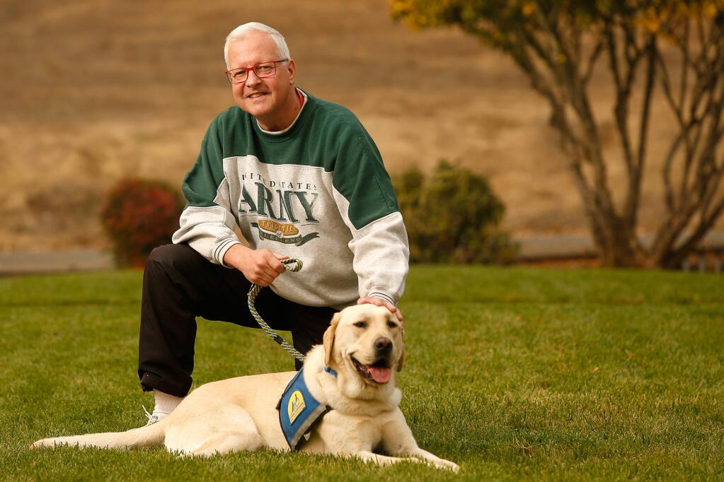 Army veteran Steve Piotter, who retired as a master sergeant after serving 25 years, poses for a portrait with his service dog Major at the church Piotter attends in Healdsburg, California, on Saturday, November 10, 2018. (Alvin Jornada / The Press Democrat)