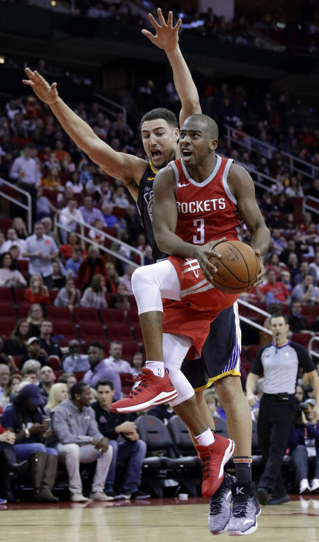 FILE - In this Jan. 20, 2018, file photo, Houston Rockets guard Chris Paul (3) shoots in front of Golden State Warriors guard Klay Thompson (11) during the second half of an NBA basketball game, in Houston. The buildup to this Golden State-Houston matchup in the Western Conference finals started in February, when Draymond Green had some pointed comments. Or in October, when the Rockets beat the Warriors on ring night. Or in June, when Chris Paul got traded. Whatever the case, the series that everyone in the NBA apparently wanted to see is about to happen. (AP Photo/Michael Wyke, File)