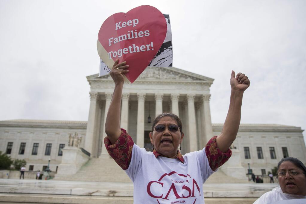 Antonio Surco of Silver Spring, Md. participates in a demonstration outside the U.S. Supreme Court on Thursday. (EVAN VUCCI / Associated Press)