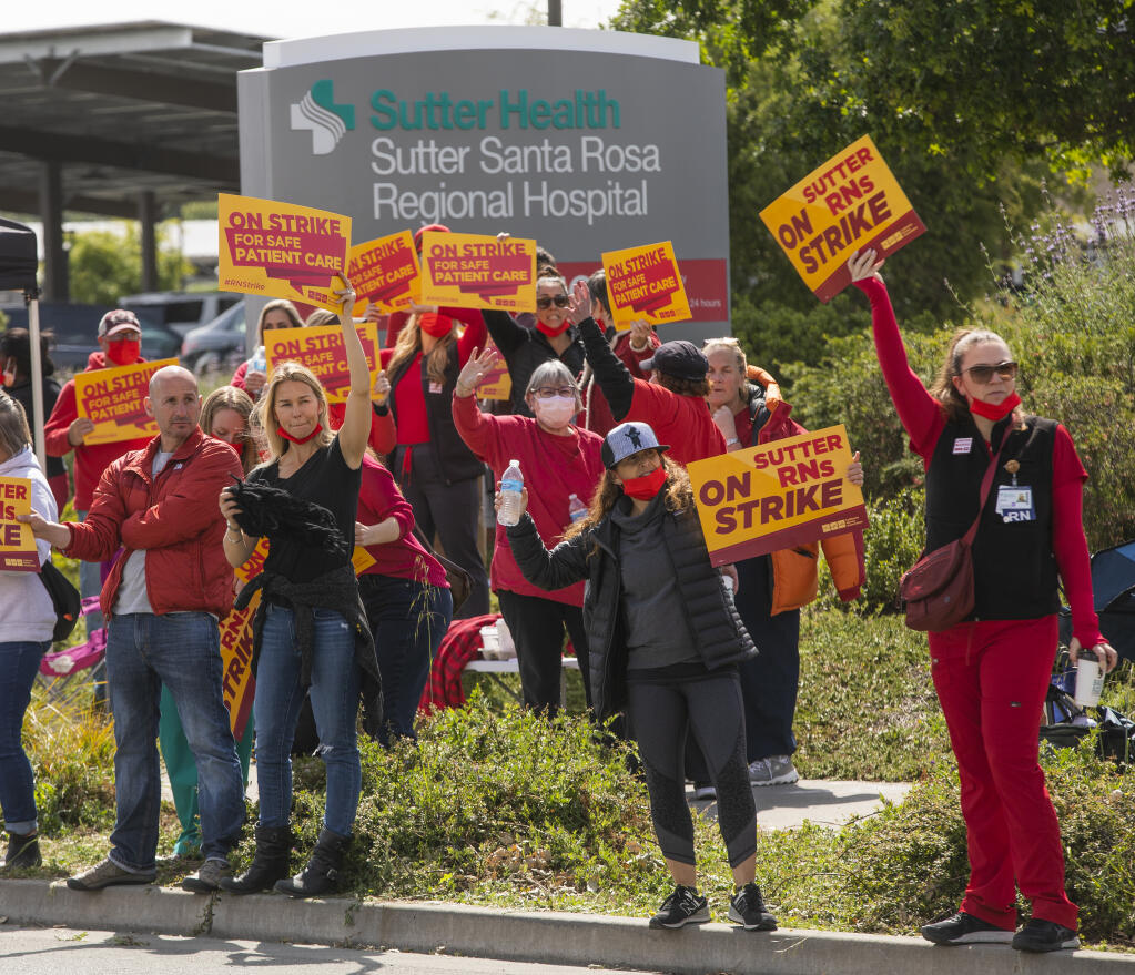 Sutter nurses protest low staffing levels outside the Santa Rosa campus along Mark West Springs Road Monday April 18, 2021 (Chad Surmick / The Press Democrat)