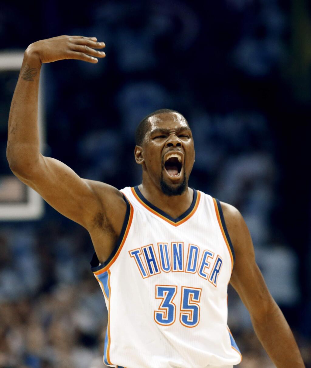 Oklahoma City Thunder forward Kevin Durant (35) celebrate against the Golden State Warriors during the first quarter in Game 3 of the NBA basketball Western Conference finals in Oklahoma City, Sunday, May 22, 2016. (AP Photo/Sue Ogrocki)