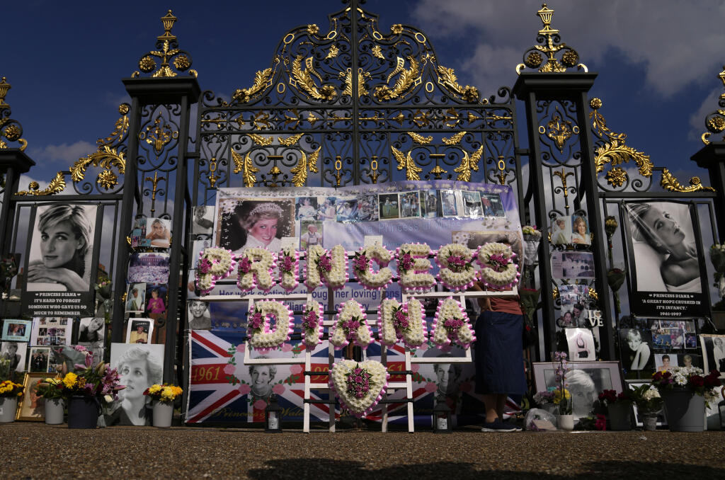 A floral arrangement in remembrance of Princess Diana outside the gates of Kensington Palace, in London, Wednesday, Aug. 31, 2022. Wednesday marks the 25th anniversary of Princess Diana's death in a Paris car crash. (AP Photo/Alastair Grant)