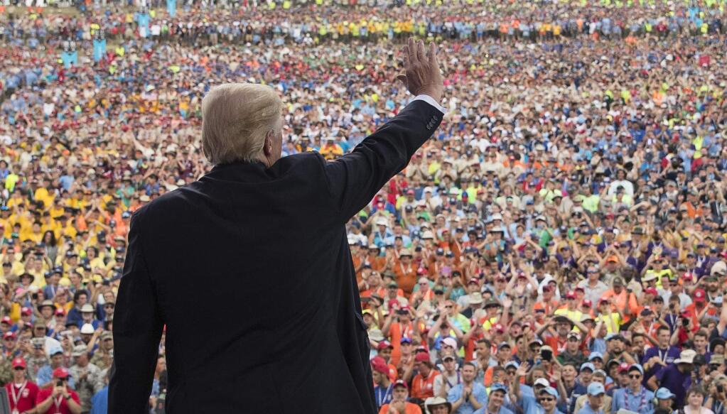 FILE - In this July 24, 2017 file photo, President Donald Trump waves to the crowd after speaking at the 2017 National Scout Jamboree in Glen Jean, W.Va. The Boy Scouts are denying a claim by President Donald Trump that the head of the youth organization called the president to praise his politically aggressive speech to the Scouts' national jamboree. (AP Photo/Carolyn Kaster, File)