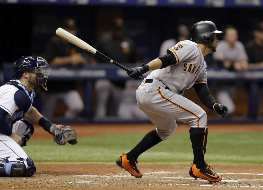 San Francisco Giants' Gregor Blanco connects for a two-run single off Tampa Bay Rays starting pitcher Chris Archer during the fourth inning Friday, June 17, 2016, in St. Petersburg, Fla. Brandon Crawford and Angel Pagan scored. Catching for the Rays is Curt Casali. (AP Photo/Chris O'Meara)