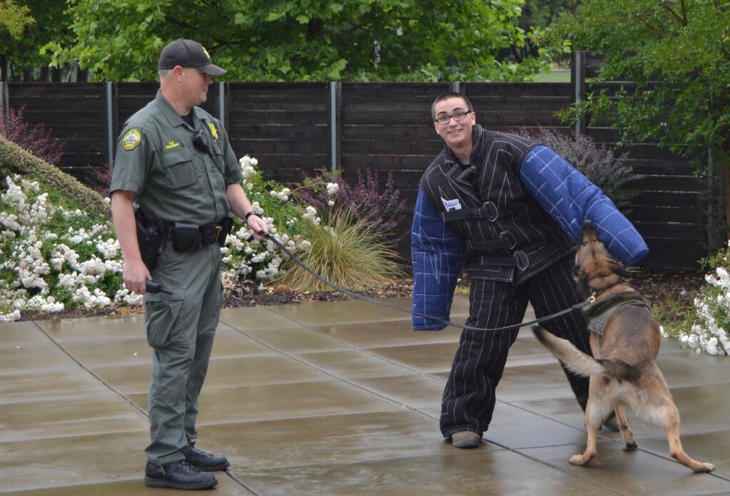 Brandon Ruiz, with deputy Sherman and a dog from the K9 unit.