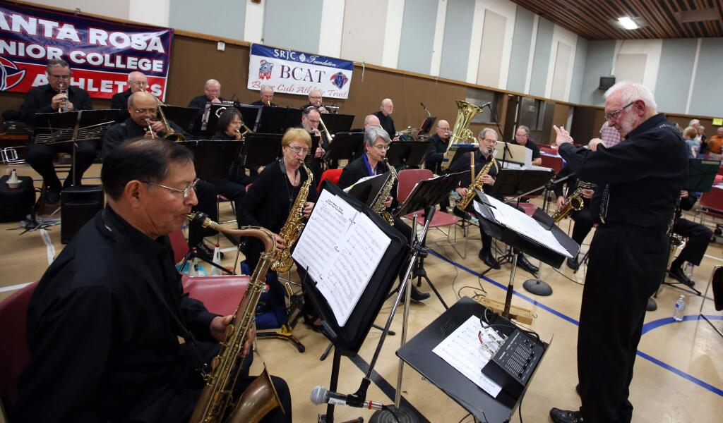 Ray Walker, right, led the New Horizons Swing Band during the Santa Rosa Junior College Fourth Annual Polenta Feed held at the Becker Center at St. Eugene's Cathedral in Santa Rosa, Saturday, January 24, 2015. The fundraiser was to raise money for the Kinesiology, Athletics and Dance Departments. (Crista Jeremiason / The Press Democrat)