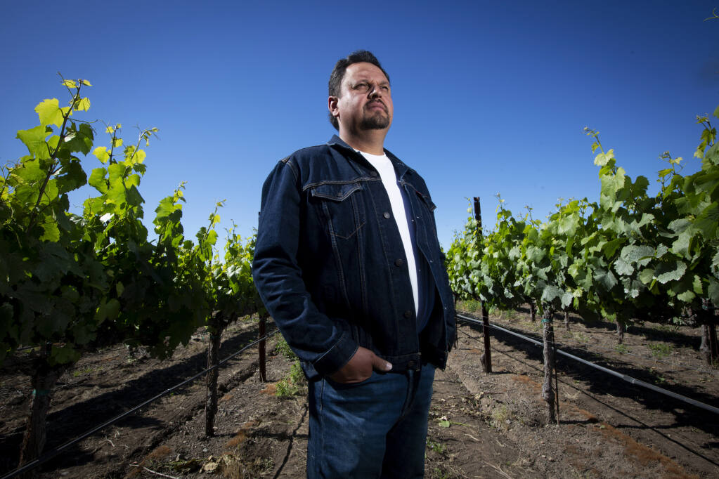 Roberto Alvarez Flores, winner of the Sonoma County Grape Growers Foundation’s 2021 Vineyard Employee of the Year, surveys a Sangiacomo vineyard on Broadway on Friday, May 13, 2022. (Robbi Pengelly/Index-Tribune)