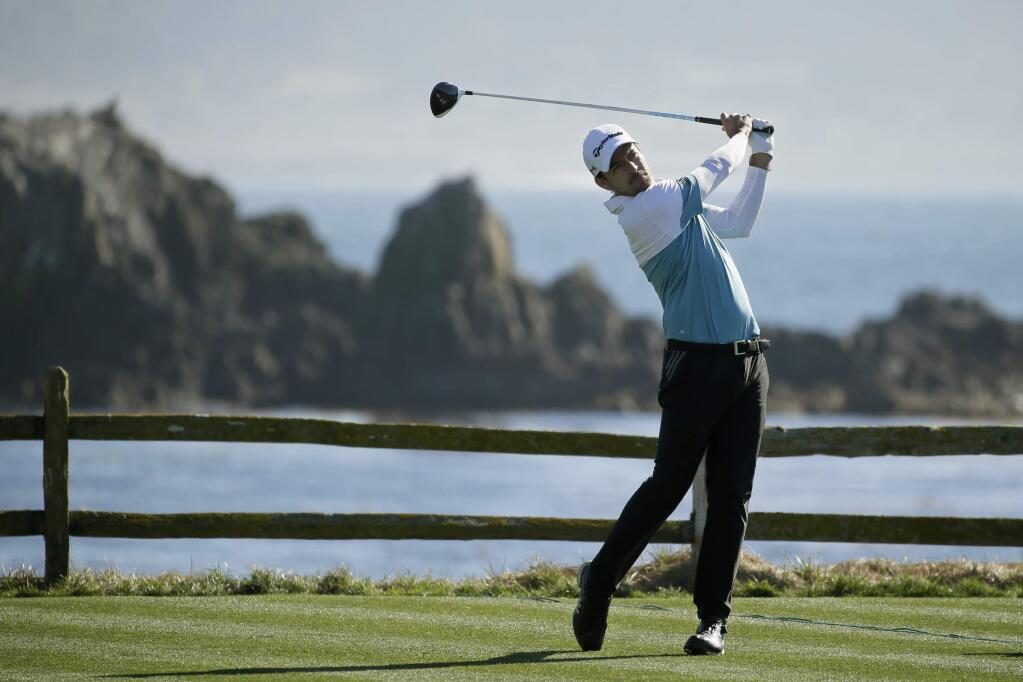 Nick Taylor, of Canada, follows his drive from the 18th green of the Pebble Beach Golf Links during the second round of the AT&T Pebble Beach National Pro-Am golf tournament Friday, Feb. 7, 2020, in Pebble Beach, Calif. (AP Photo/Eric Risberg)